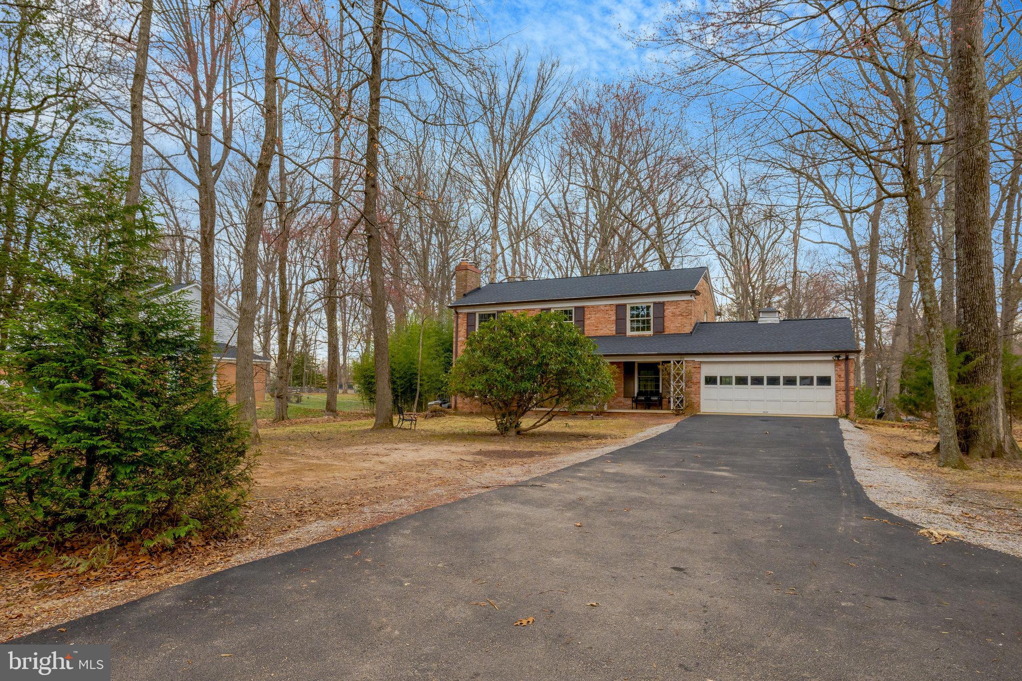 11332 Vale Road Oakton, VA 22124 - Photo 4 of 52 a view of house with outdoor space and parking