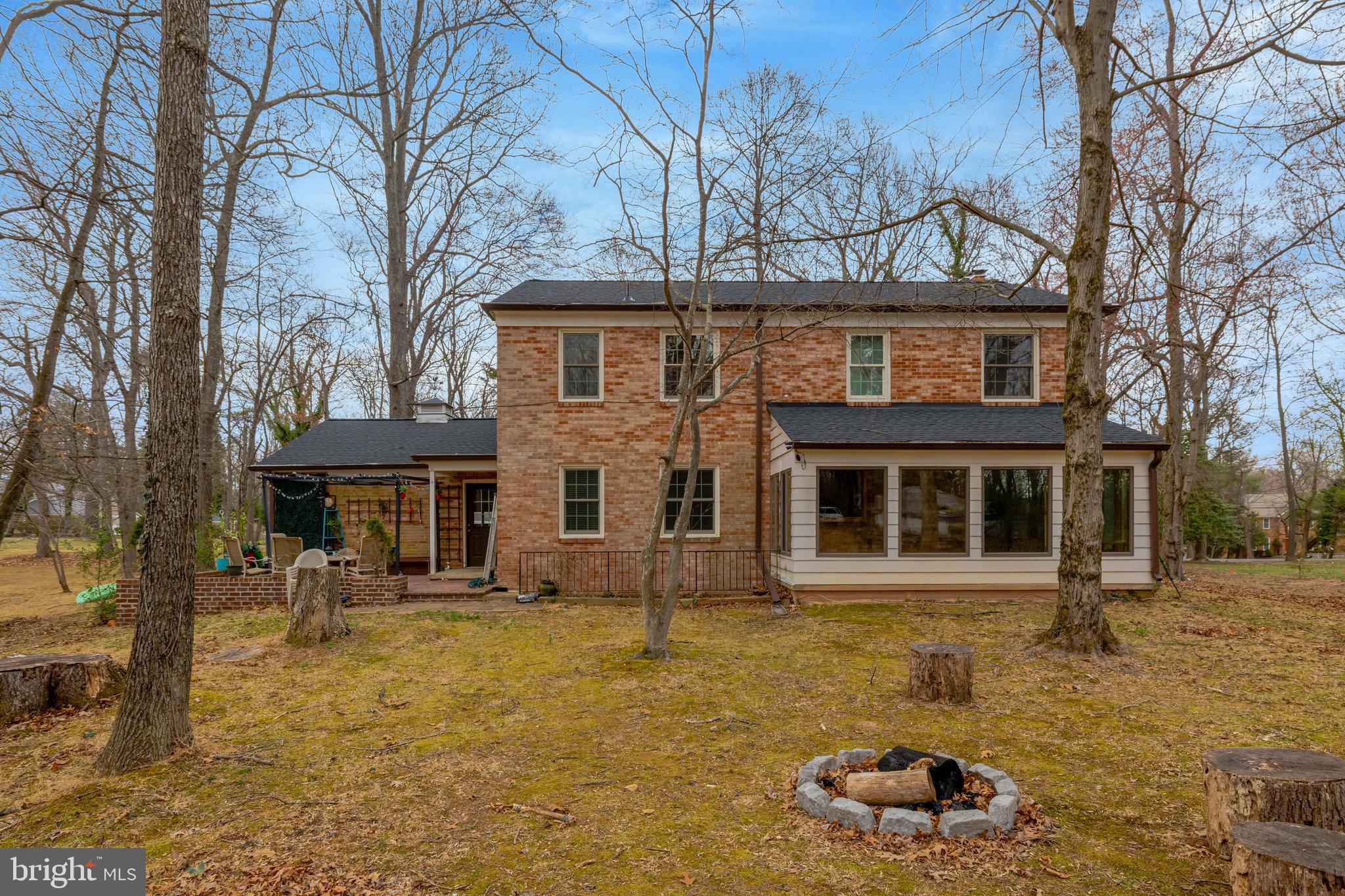 11332 Vale Road Oakton, VA 22124 - Photo 45 of 52 a front view of a house with garden