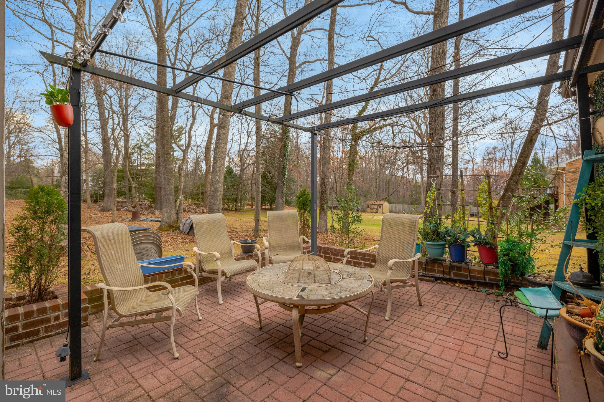 11332 Vale Road Oakton, VA 22124 - Photo 47 of 52 a building outdoor space with patio lots of furniture and glass door