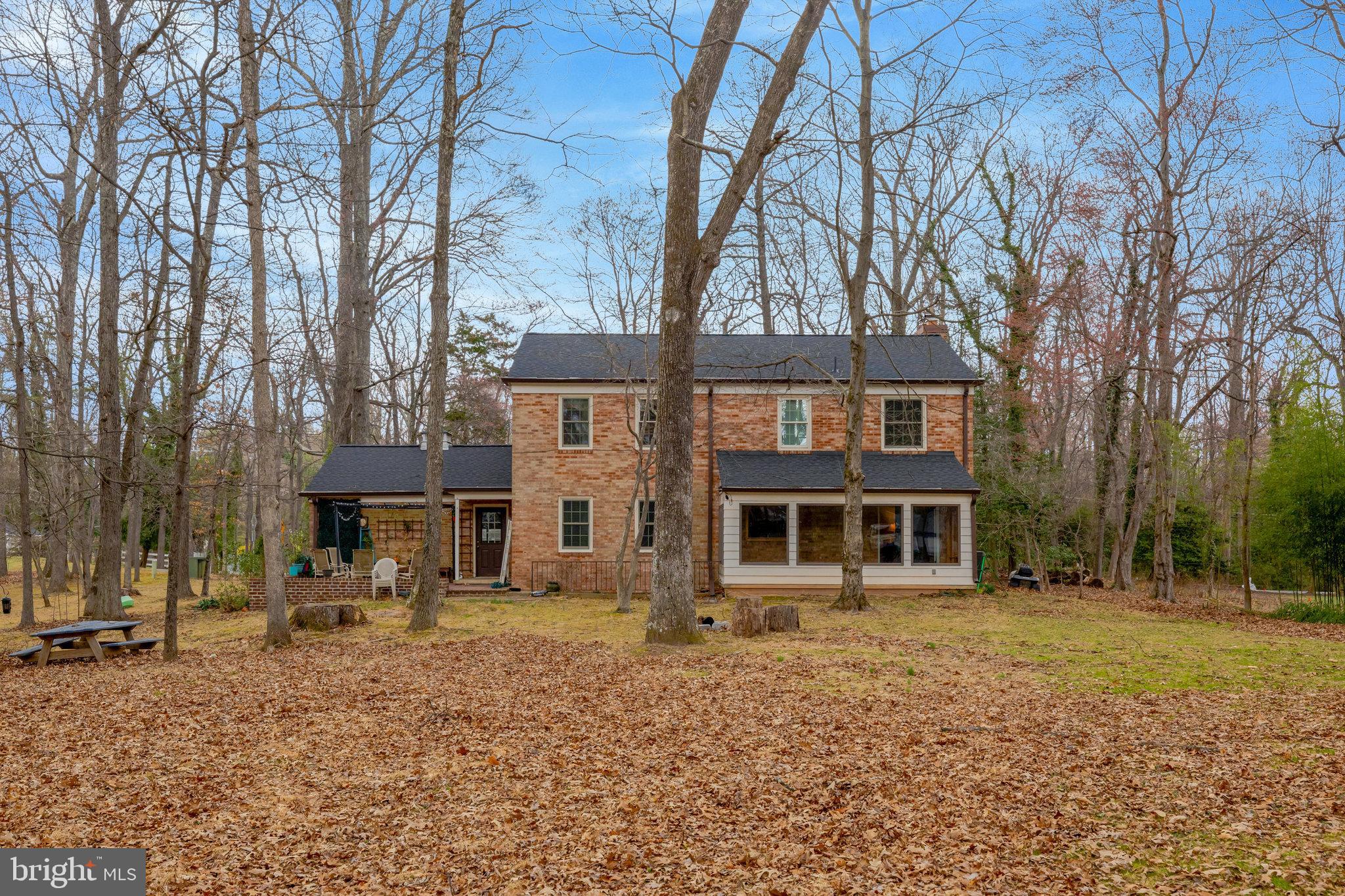 11332 Vale Road Oakton, VA 22124 - Photo 50 of 52 a front view of a house with a yard