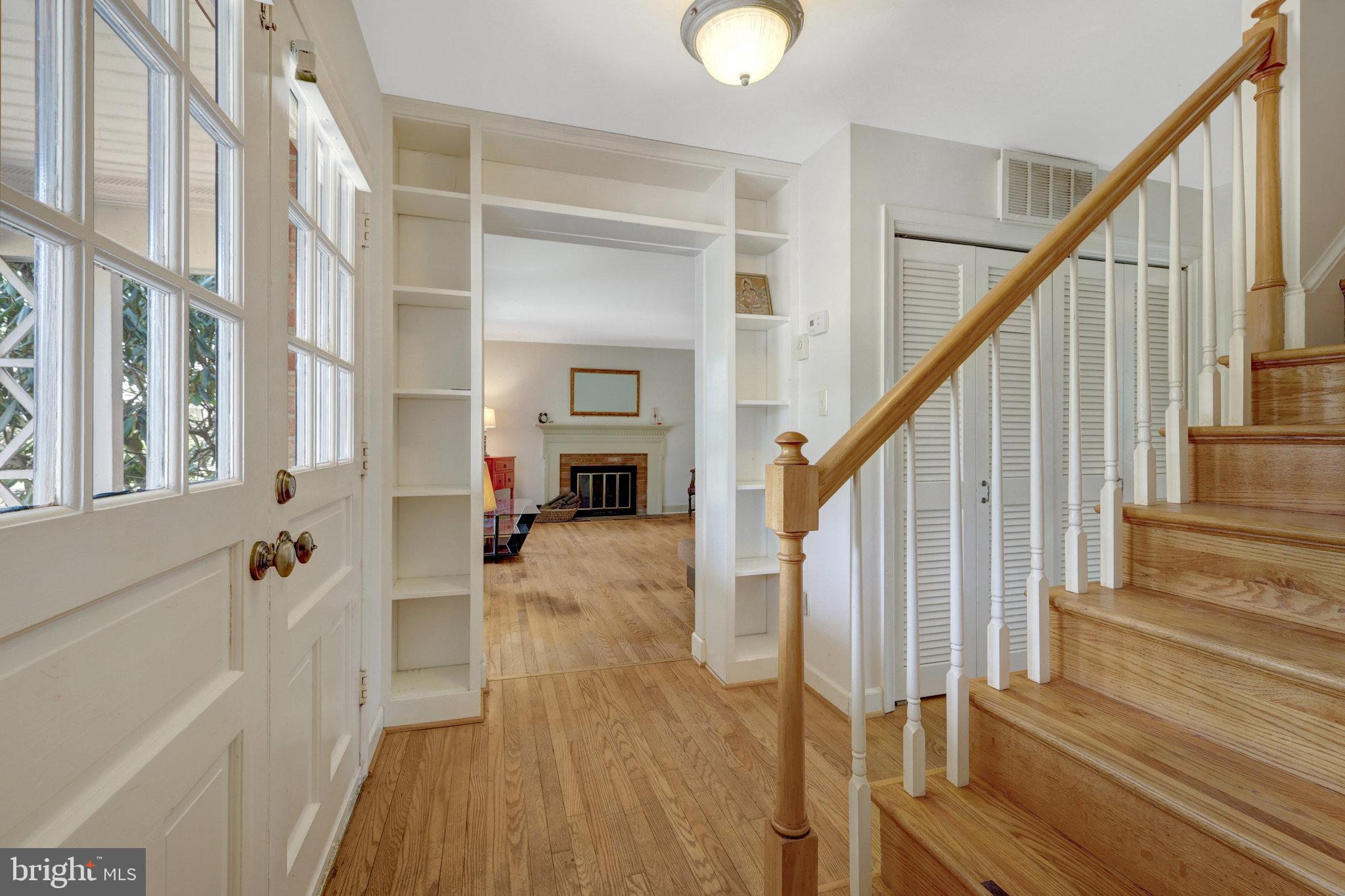 11332 Vale Road Oakton, VA 22124 - Photo 6 of 52 a view of an entryway with wooden floor and staircase