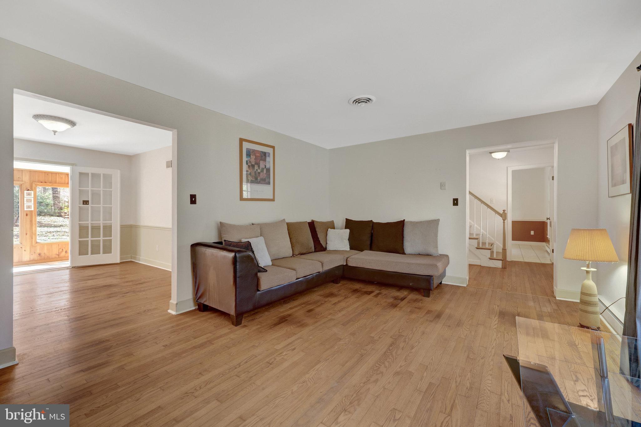 11332 Vale Road Oakton, VA 22124 - Photo 9 of 52 a living room with furniture and a wooden floor