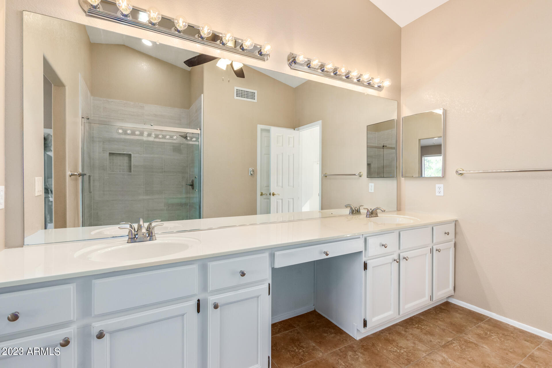 4266 East Agave Road Phoenix, AZ 85044 - Photo 19 of 54 a bathroom with a sink double vanity and a mirror