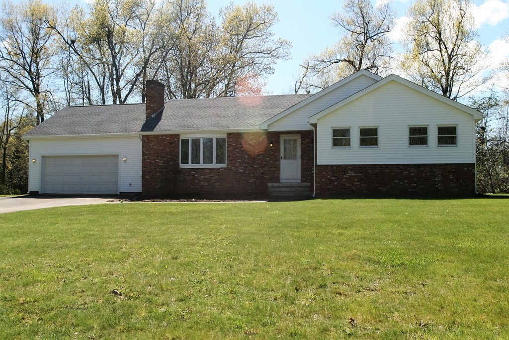 100 Signal Hill Circle Springfield, MA 01118 - Photo 1 of 19 a house view with a garden space