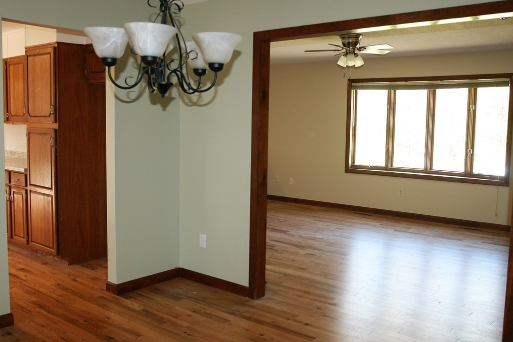 100 Signal Hill Circle Springfield, MA 01118 - Photo 7 of 19 a view of empty room with wooden floor and fan