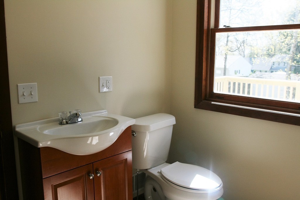 100 Signal Hill Circle Springfield, MA 01118 - Photo 8 of 19 a bathroom with a sink a toilet and a window