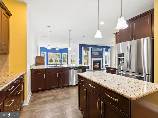 a kitchen with a sink stove and refrigerator