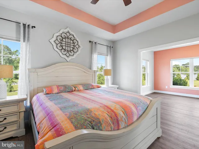 a view of an empty room and wooden floor