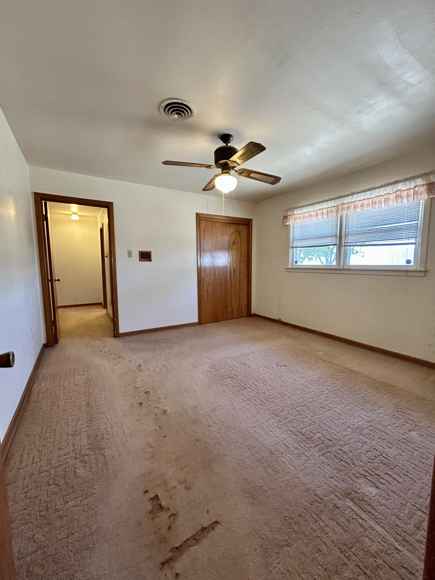 2101 Farm To Market 97 Lockney, TX 79241 - Photo 16 of 35 an empty room with windows and fan