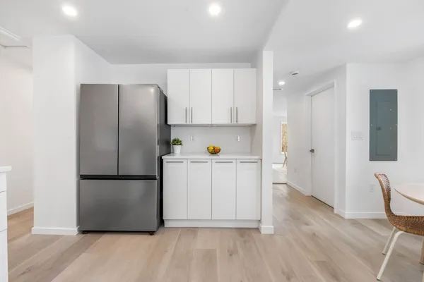 a kitchen with stainless steel appliances a refrigerator stove microwave and cabinets