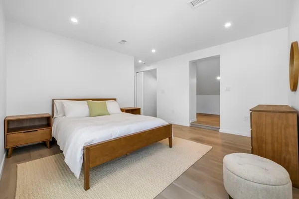a bedroom with bed and a window