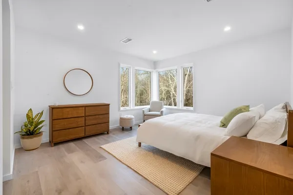 a bedroom with a bed and a couch