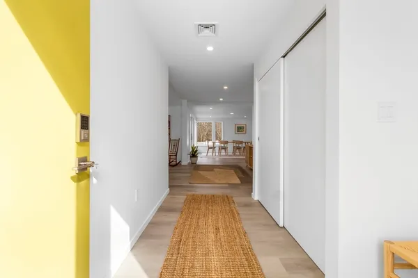 a view of a bathroom from the hallway