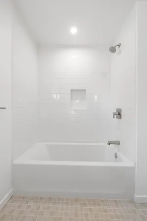 a bedroom with a bed and a table