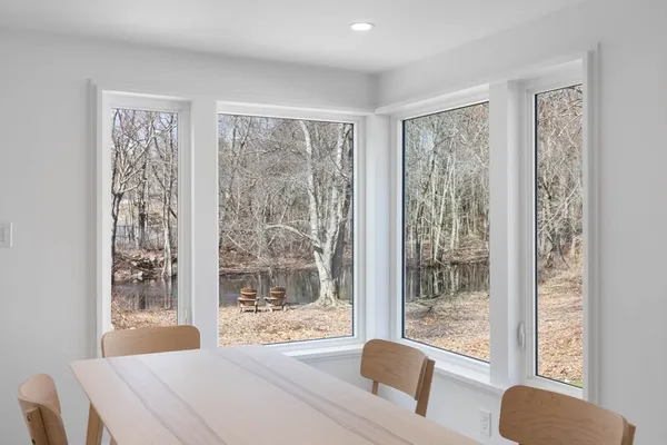a view of a dining room with furniture and a table