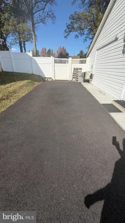 a view of a house with a yard and garage