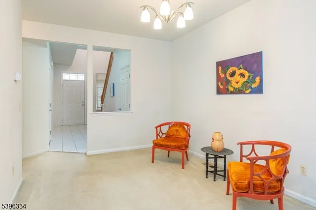 a view of a livingroom with furniture and workspace