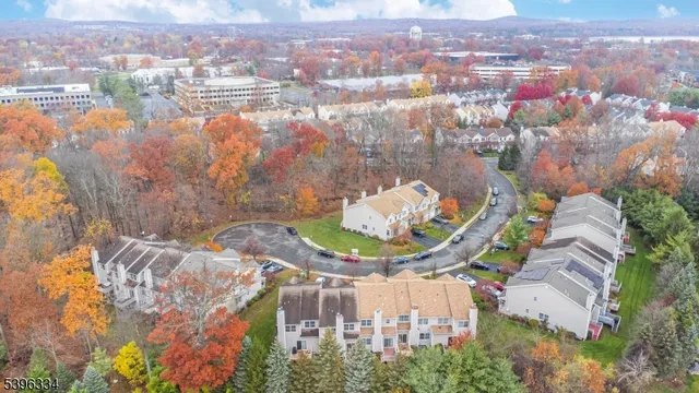 an aerial view of residential house with outdoor space and swimming pool
