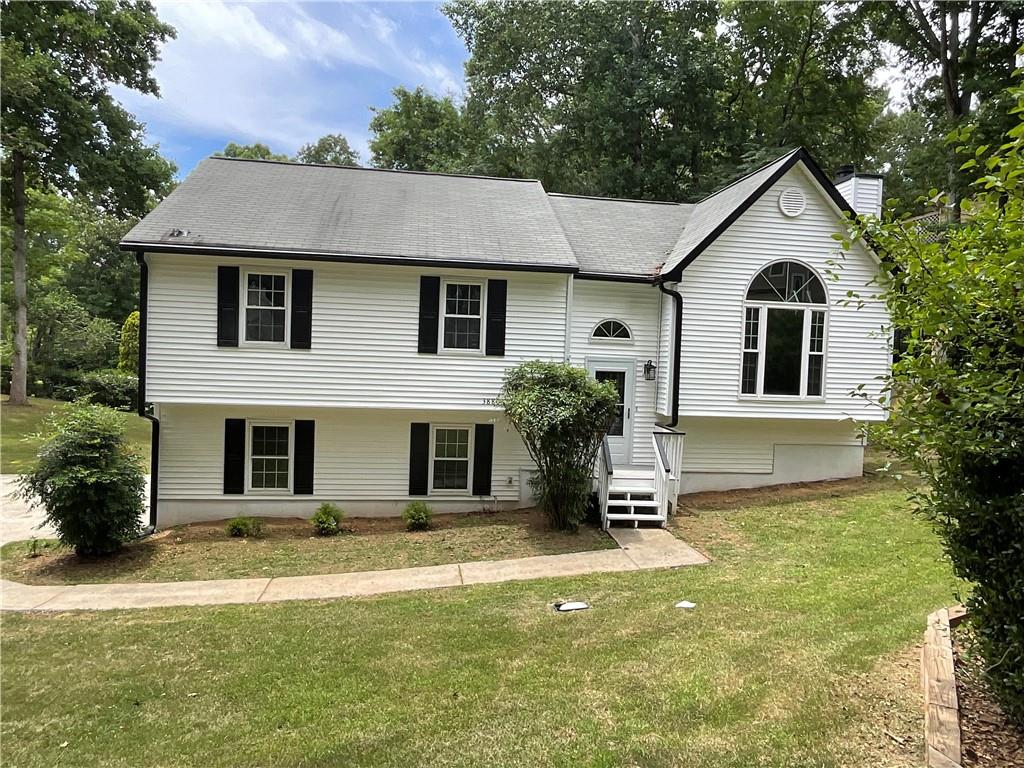 3880 Nowlin Road Kennesaw, GA 30144 - Photo 1 of 1 a front view of a house with a yard