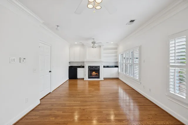 a bedroom with a bed and flat screen tv
