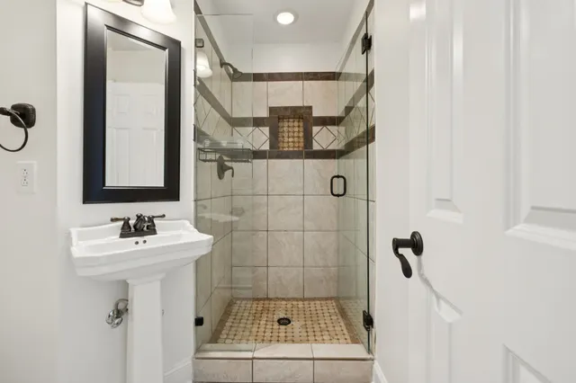 a bathroom with a bathtub and a shower