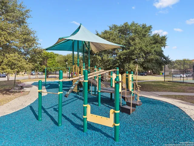 a view of a swimming pool with a lawn chairs