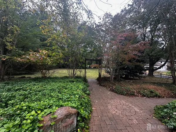 a view of a backyard with sitting area