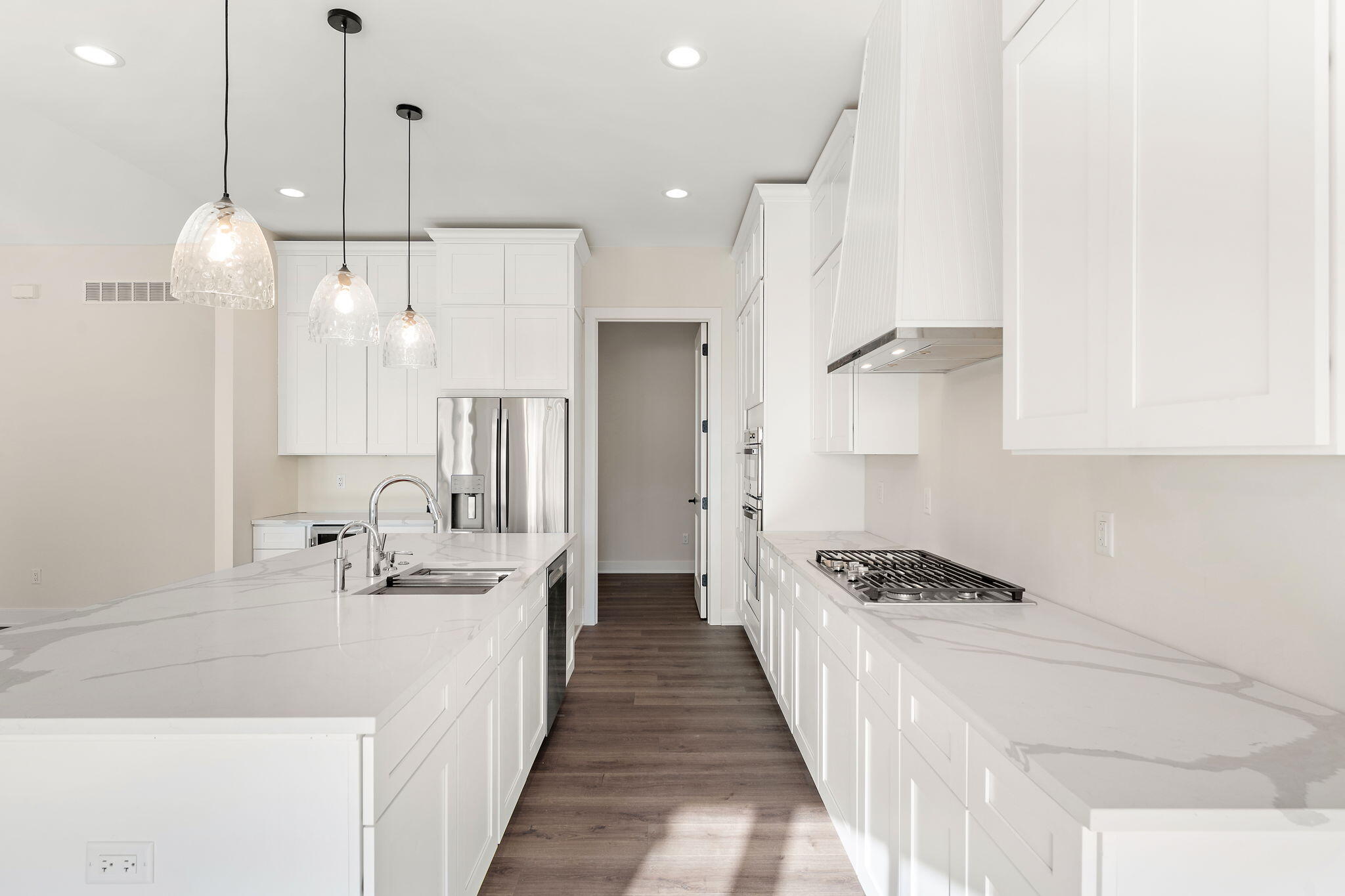 16669 Noble Street Lowell, IN 46356 - Photo 15 of 55 a kitchen with stainless steel appliances kitchen island a refrigerator and a sink