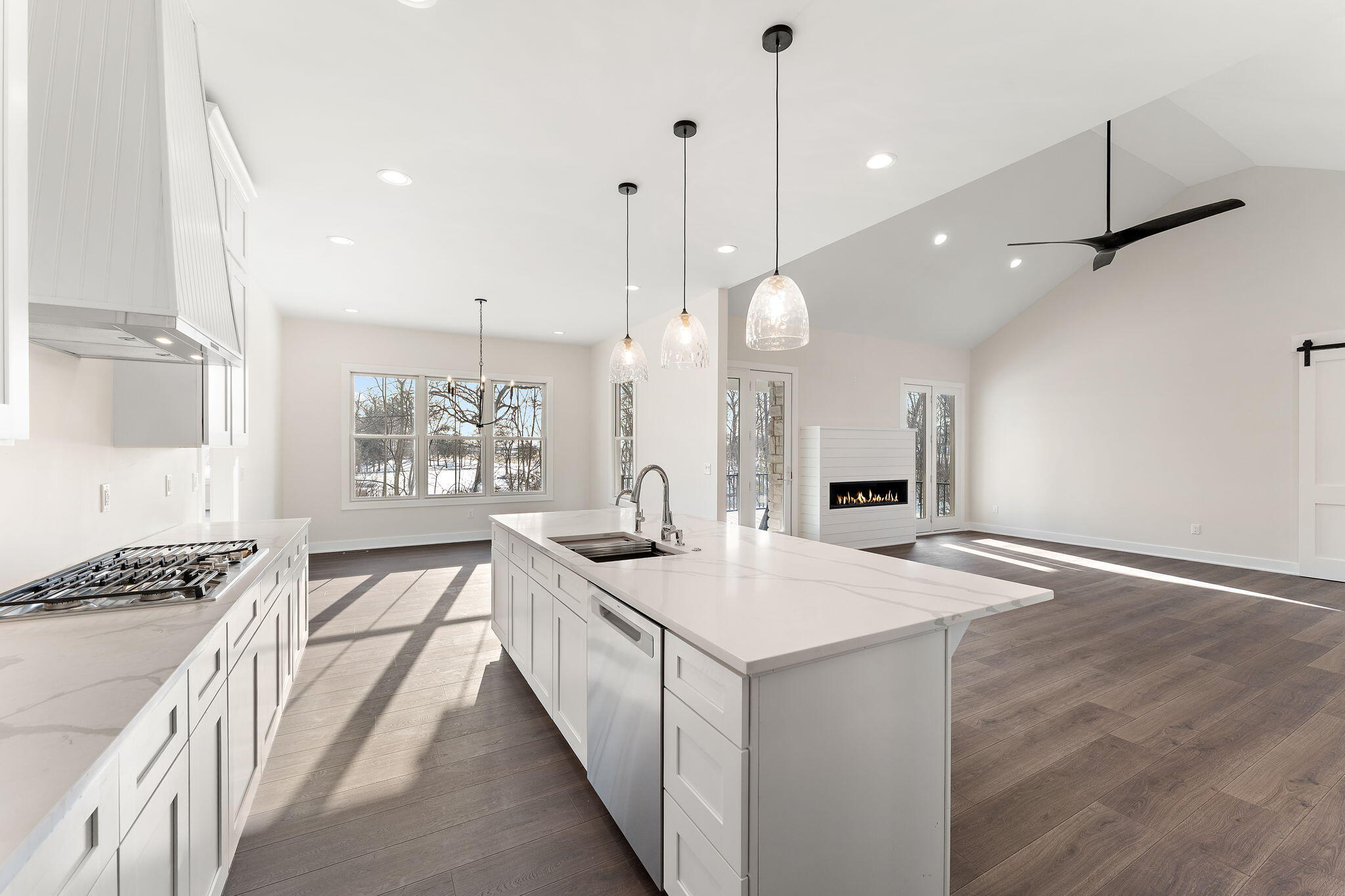 16669 Noble Street Lowell, IN 46356 - Photo 19 of 55 a kitchen with a sink stove and wooden floor