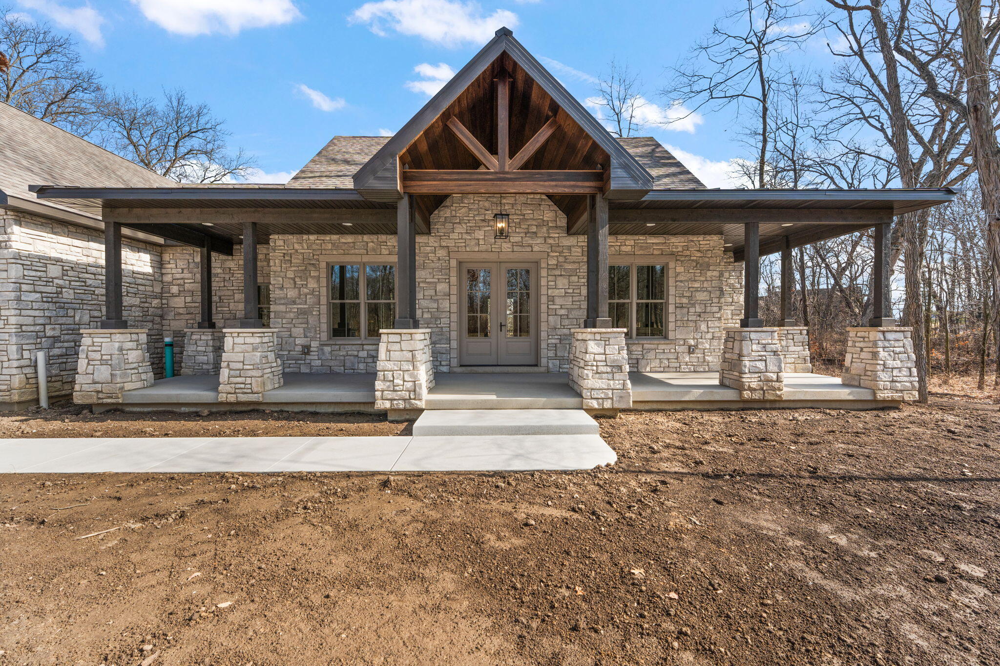 16669 Noble Street Lowell, IN 46356 - Photo 2 of 55 a front view of a house with a porch
