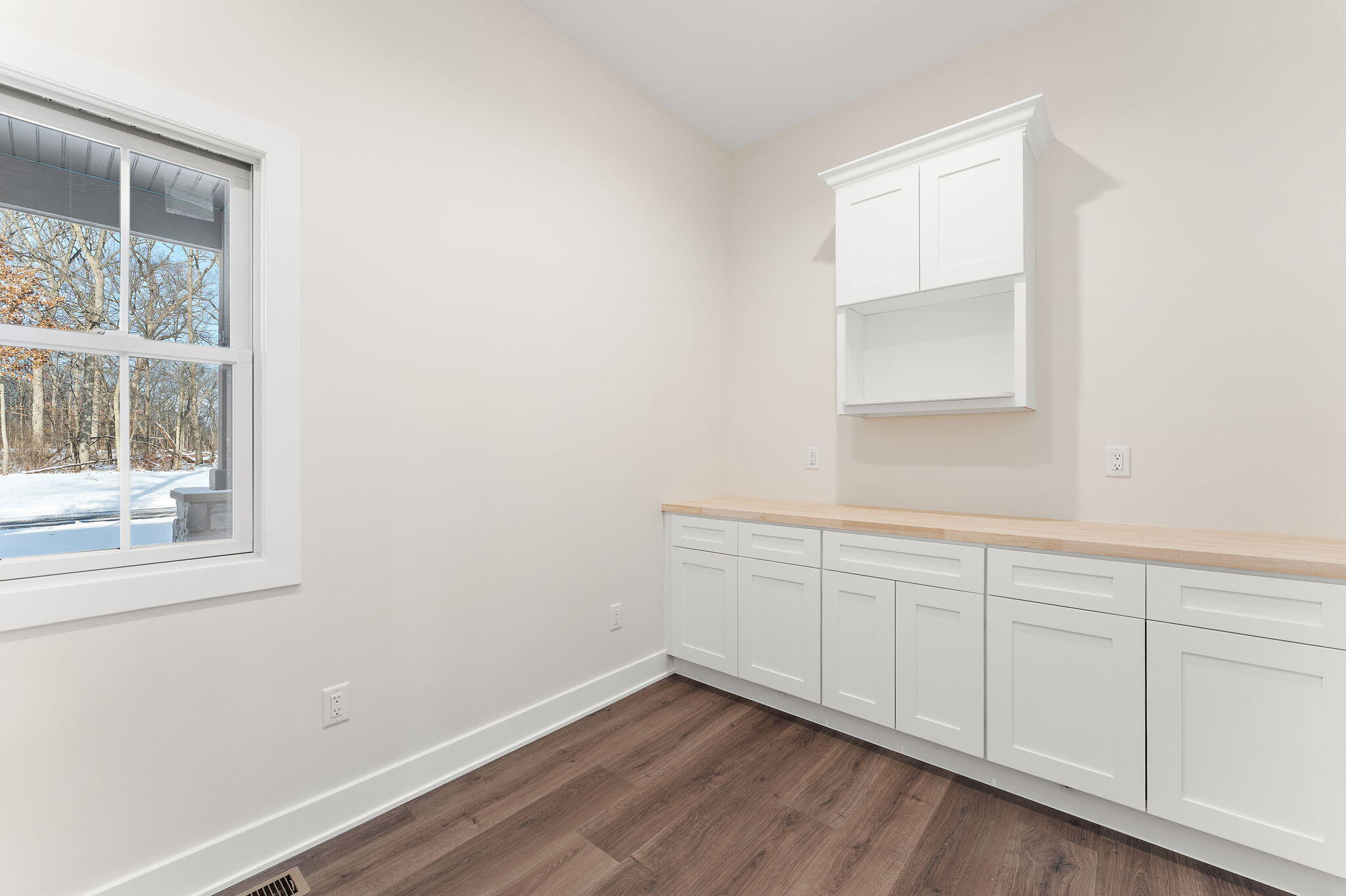 16669 Noble Street Lowell, IN 46356 - Photo 21 of 55 a view of an empty room with wooden floor and a window