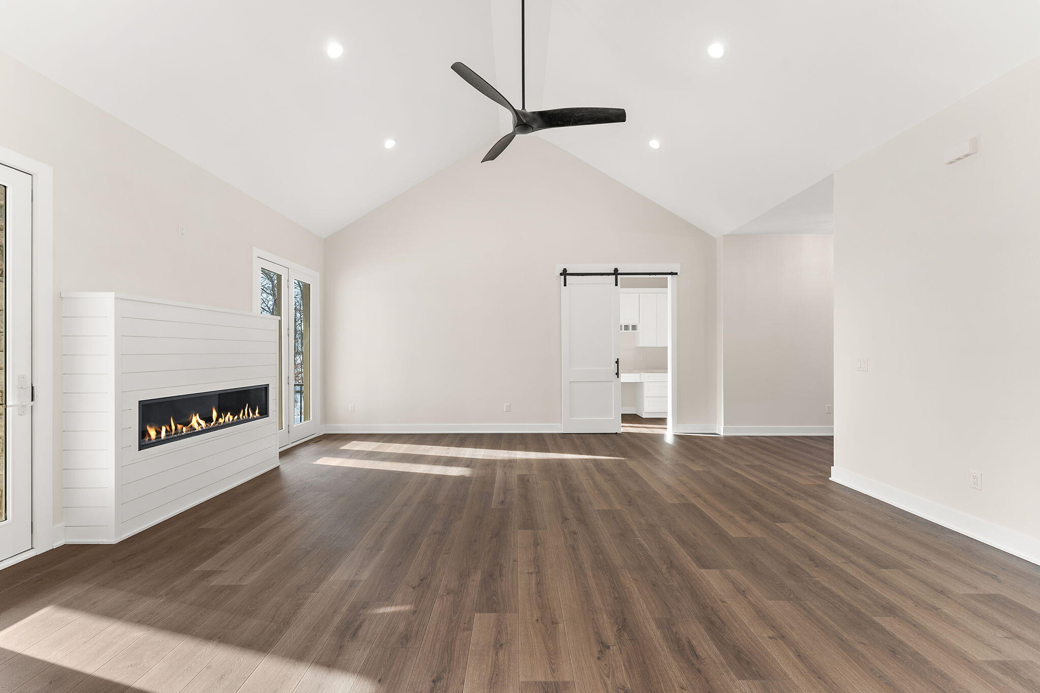 16669 Noble Street Lowell, IN 46356 - Photo 23 of 55 wooden floor in an empty room with a fireplace