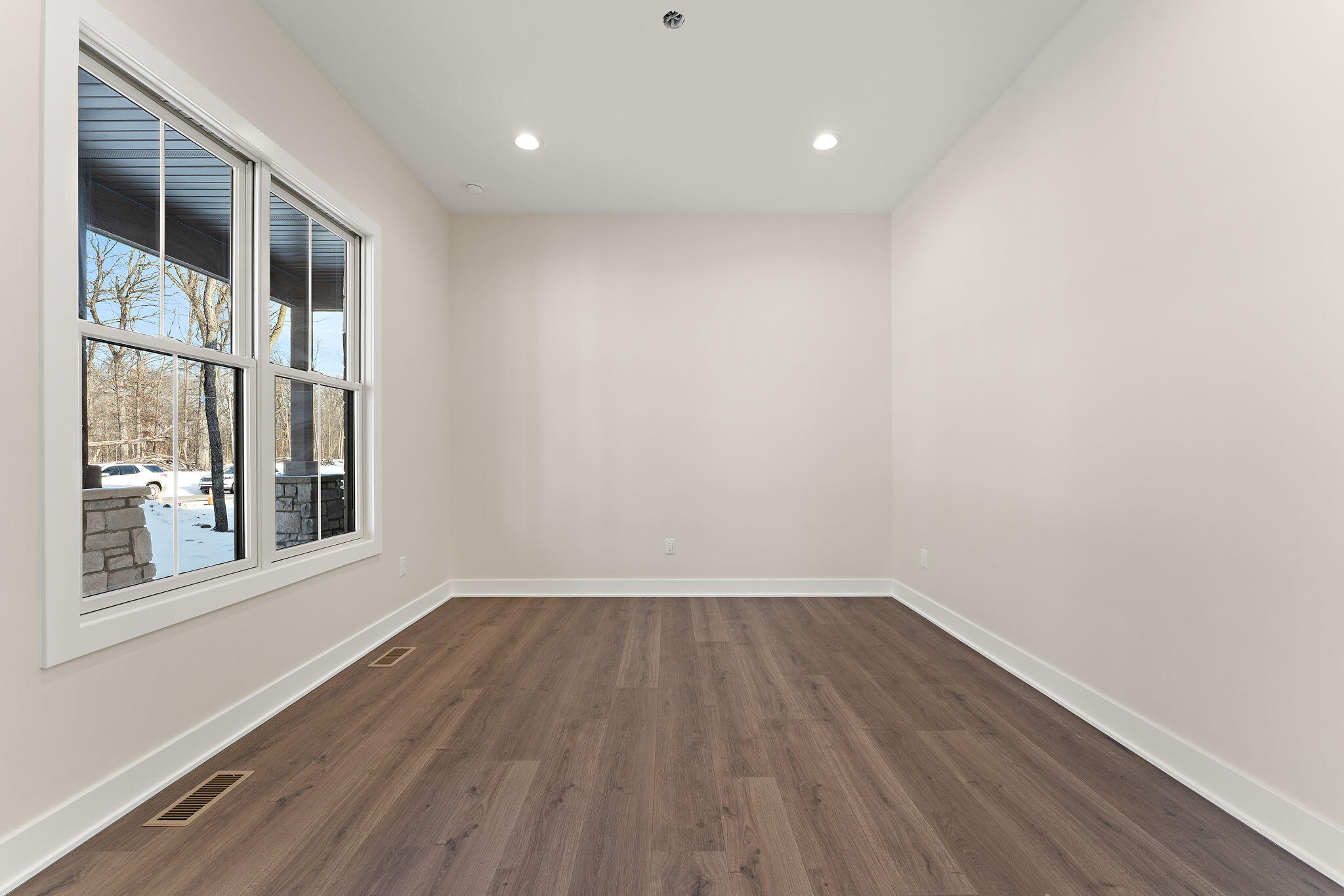16669 Noble Street Lowell, IN 46356 - Photo 25 of 55 a view of empty room with wooden floor and fan
