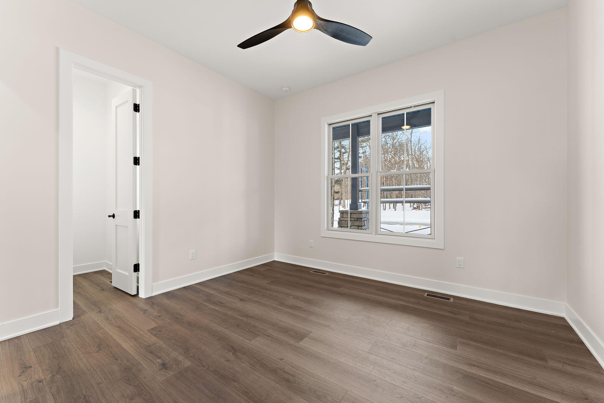 16669 Noble Street Lowell, IN 46356 - Photo 28 of 55 a view of an empty room with wooden floor and a window