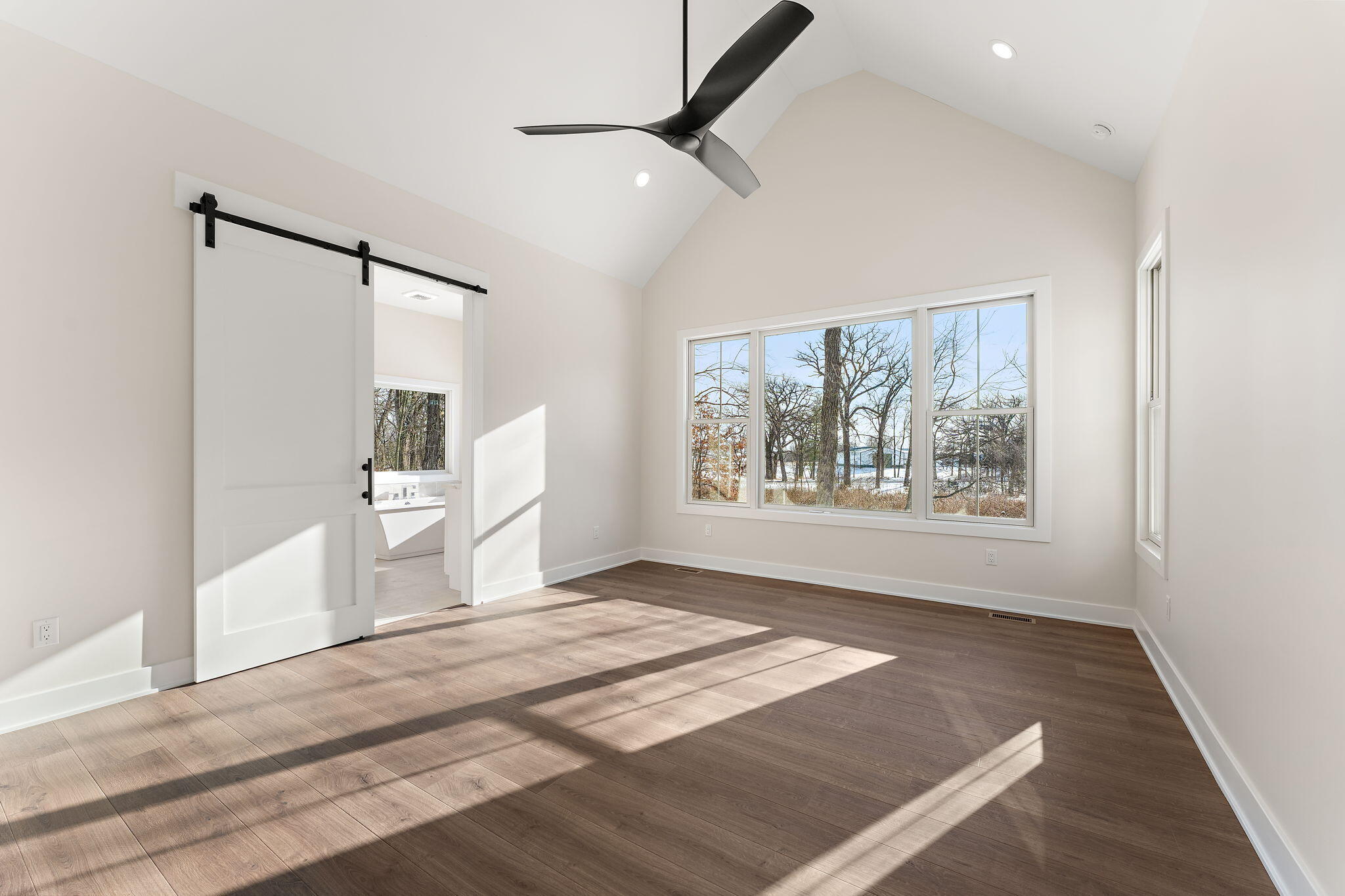 16669 Noble Street Lowell, IN 46356 - Photo 33 of 55 a view of empty room with wooden floor and fan