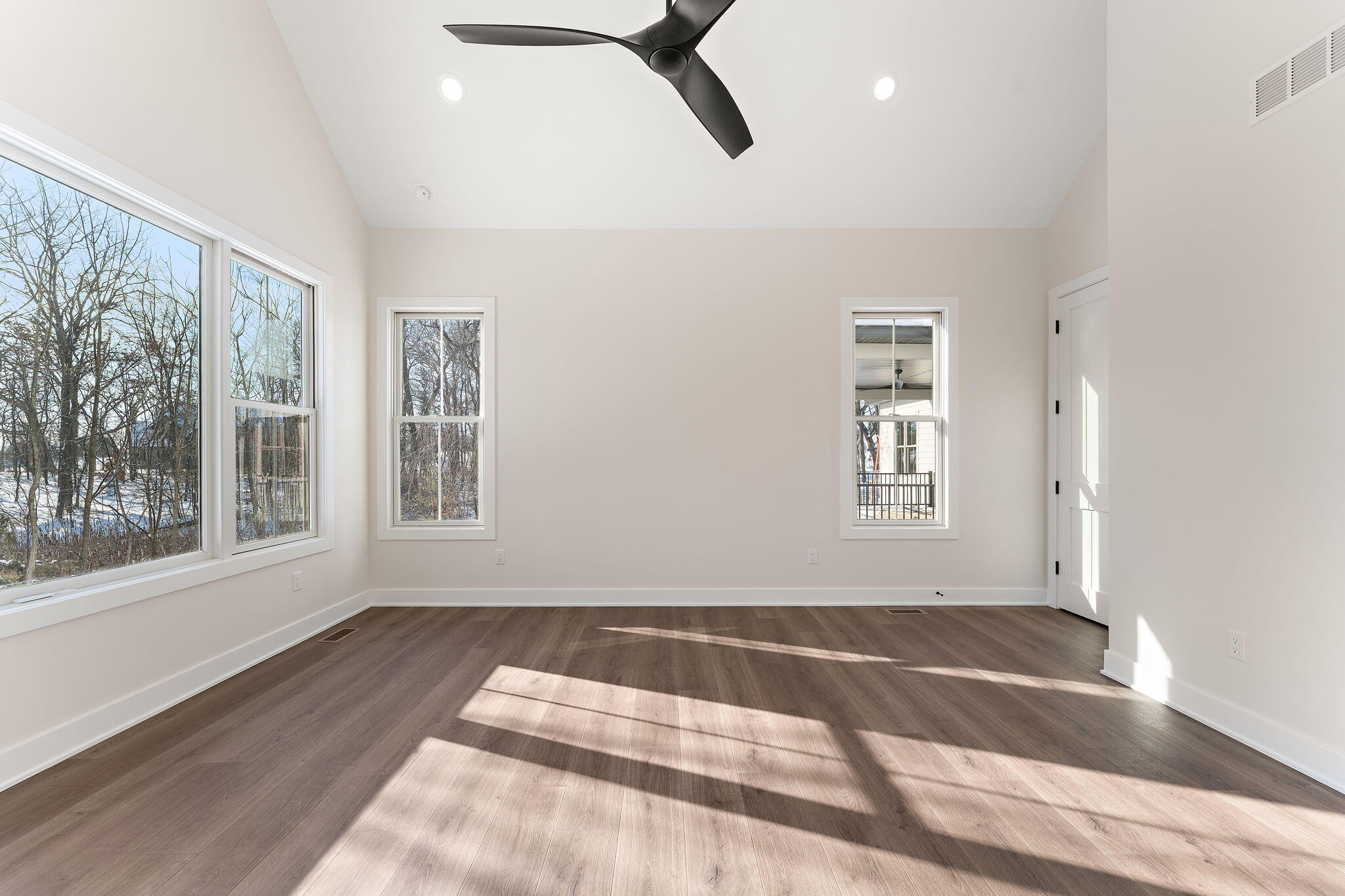 16669 Noble Street Lowell, IN 46356 - Photo 34 of 55 a view of an empty room with a window and wooden floor