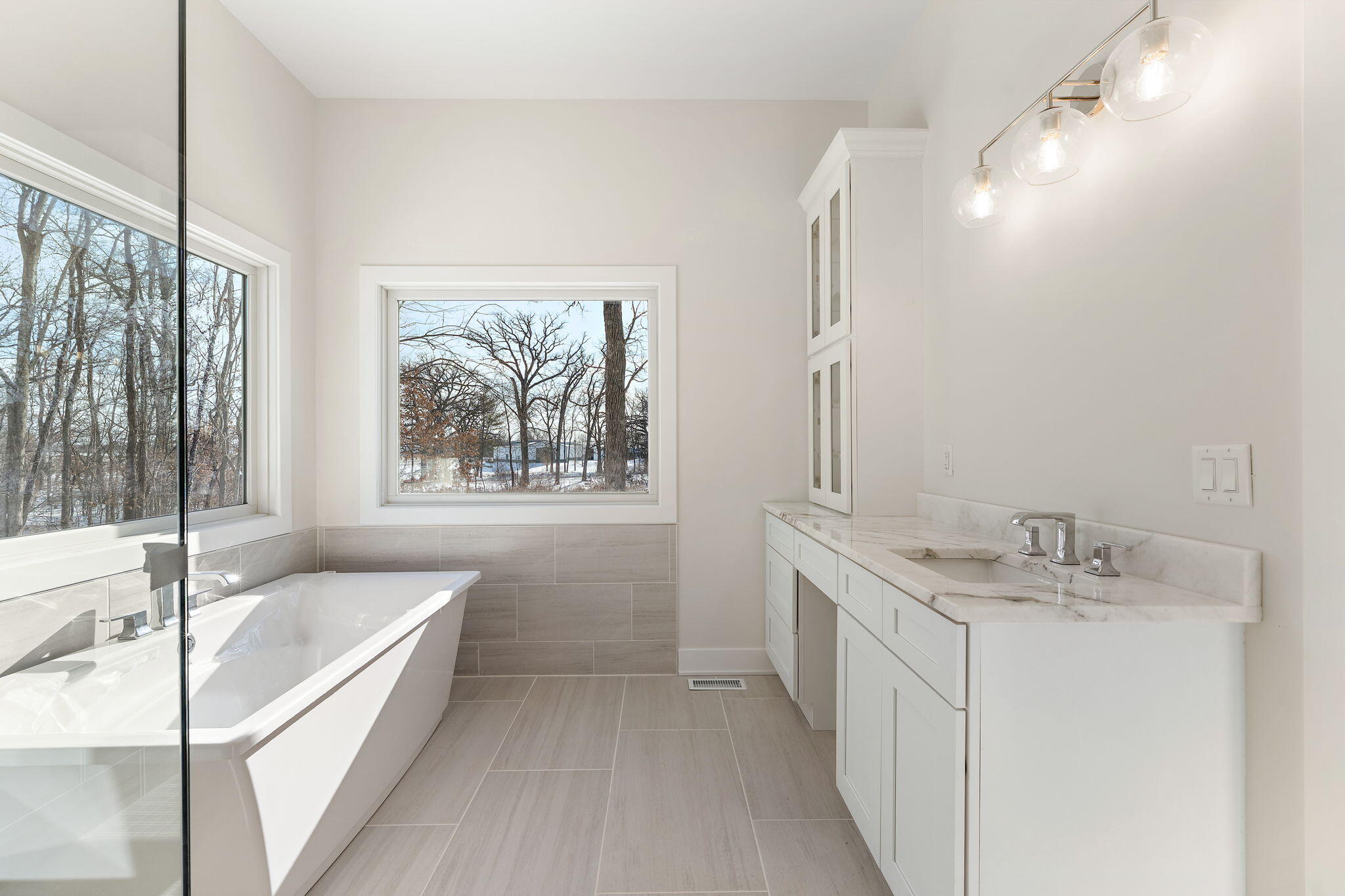 16669 Noble Street Lowell, IN 46356 - Photo 35 of 55 a bathroom with a granite countertop sink mirror and a bathtub
