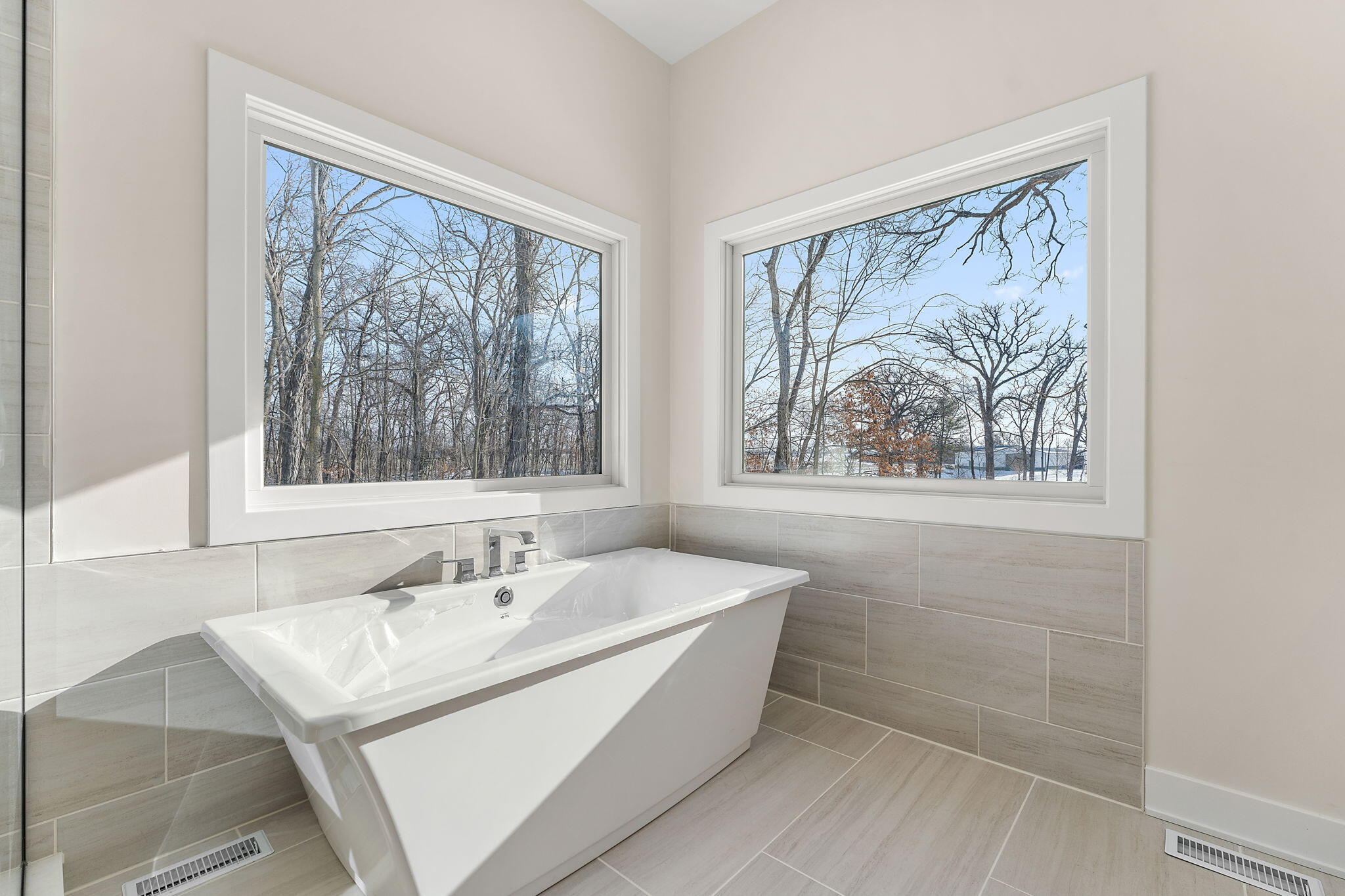 16669 Noble Street Lowell, IN 46356 - Photo 36 of 55 a bathroom with a sink a mirror and a window