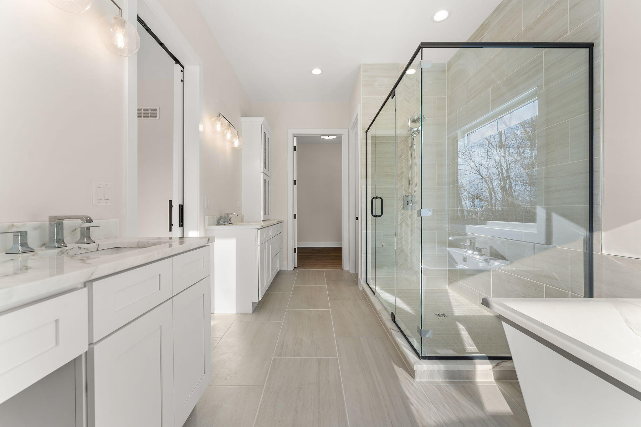 16669 Noble Street Lowell, IN 46356 - Photo 37 of 55 a bathroom with a double vanity sink and mirror with bathtub