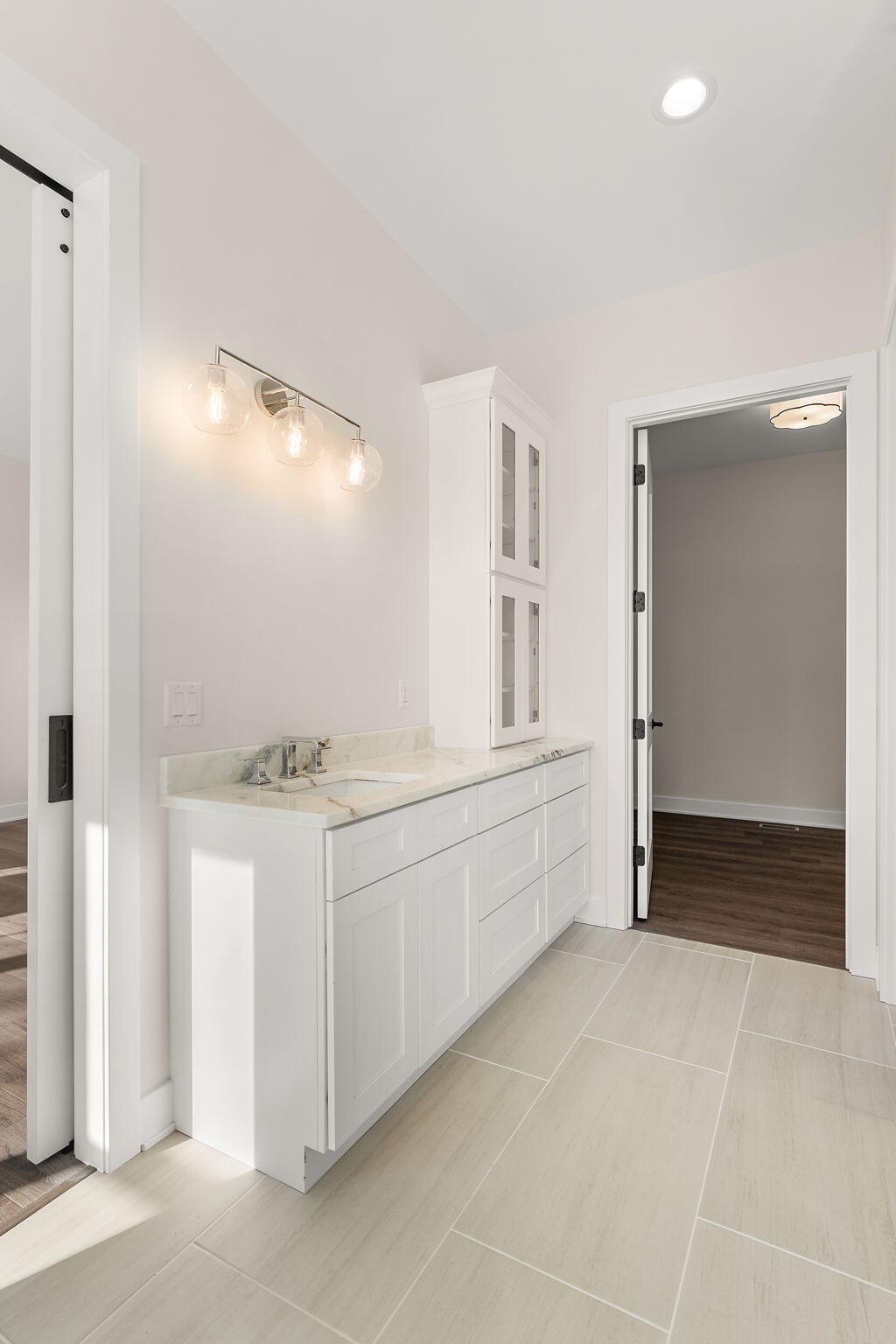 16669 Noble Street Lowell, IN 46356 - Photo 39 of 55 a bathroom with a sink and a mirror