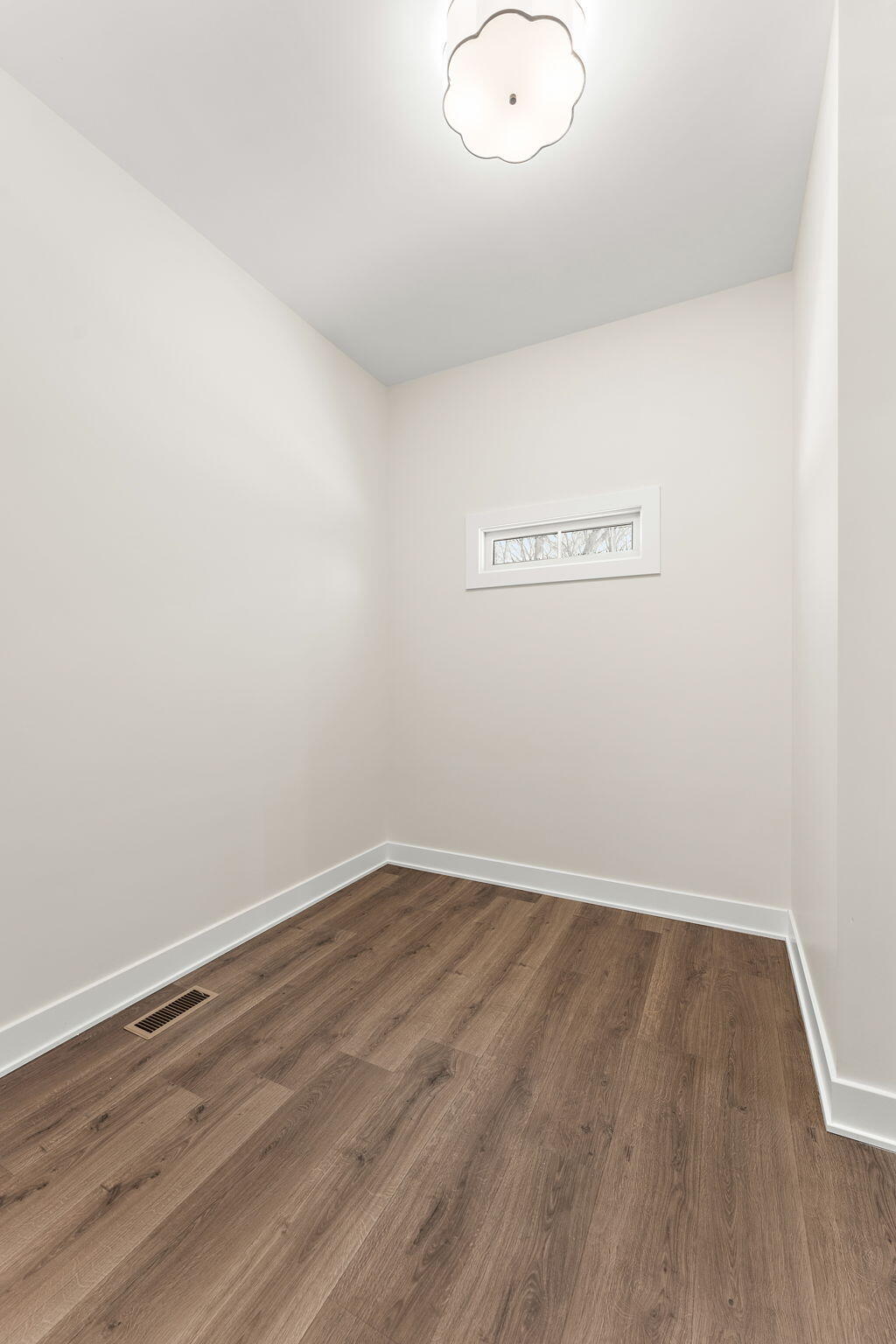 16669 Noble Street Lowell, IN 46356 - Photo 40 of 55 an empty room with wooden floor