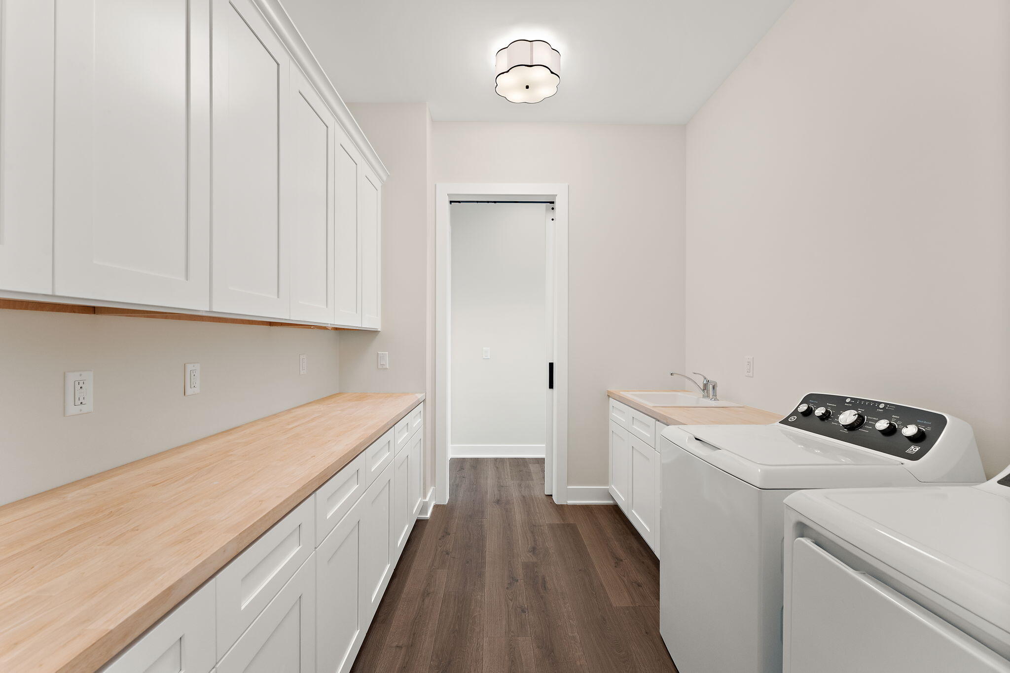 16669 Noble Street Lowell, IN 46356 - Photo 41 of 55 a hallway with washer and dryer