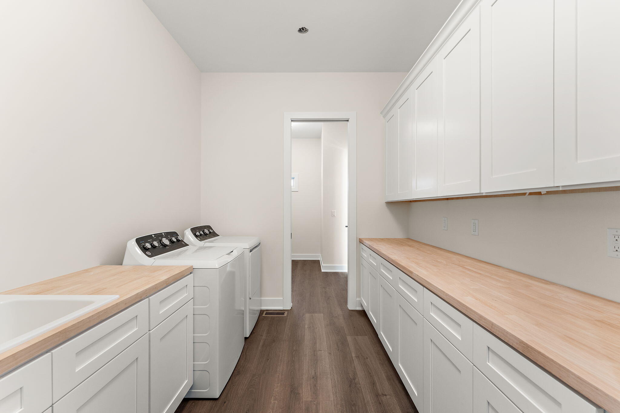 16669 Noble Street Lowell, IN 46356 - Photo 42 of 55 a kitchen with a refrigerator and white cabinets