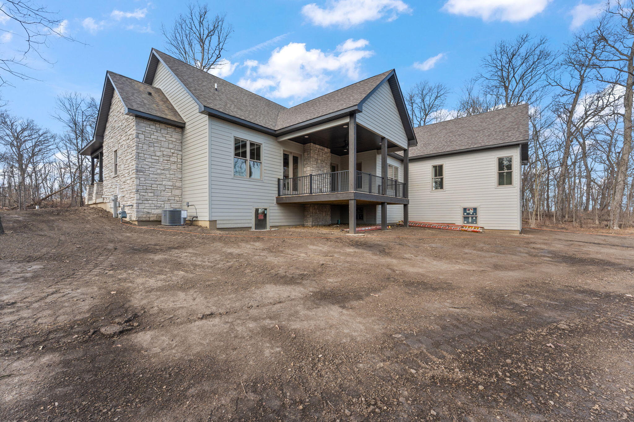 16669 Noble Street Lowell, IN 46356 - Photo 53 of 55 a view of a house with a large tree and wooden fence