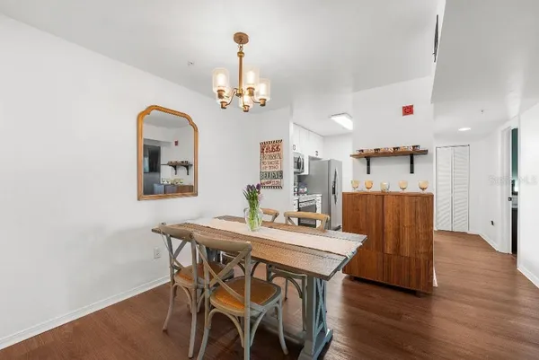 a view of a dining room with furniture and wooden floor