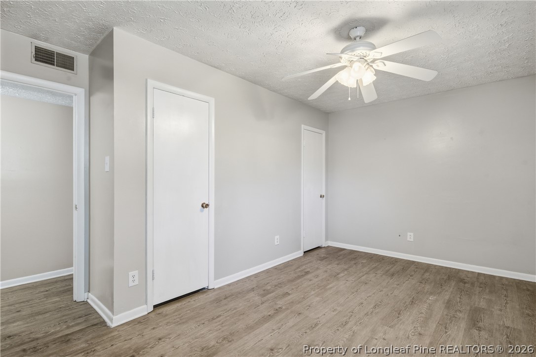 6319 Rustic Ridge Hope Mills, NC 28348 - Photo 22 of 39 a view of an empty room and wooden floor