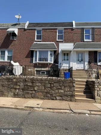 a front view of a house with residential houses
