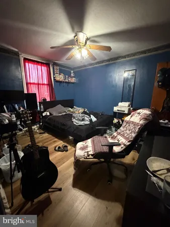 a room with a bed and a flat screen tv