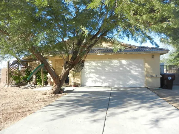 a view of a trees in front of a house