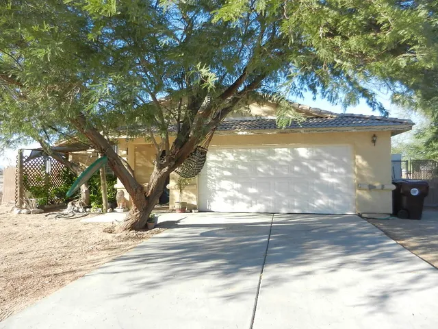 a view of a trees in front of a house